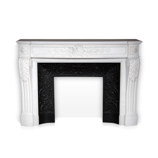 Arcadia is a custom-made Louis XVI style fireplace mantel made out of marble, with a curved entablature and with a pan flute and floral carving. 
