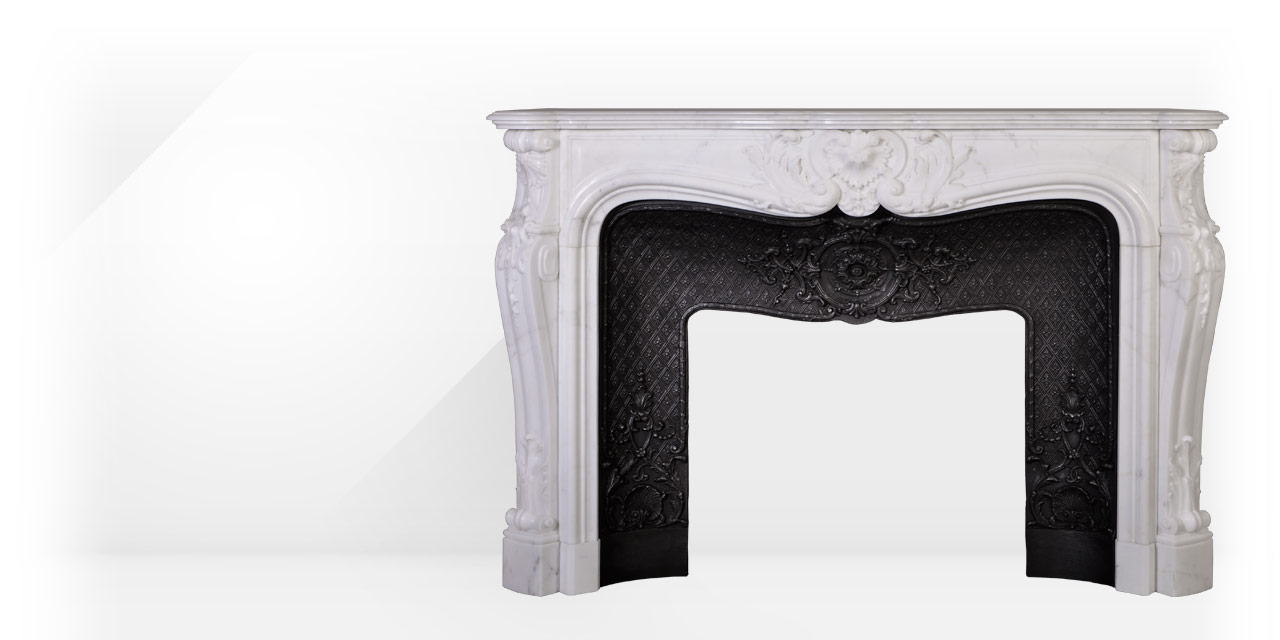 The Hotel de Lassay mantel is a custom-made mantel with a richly carved decor characteristic of the Louis XV style.