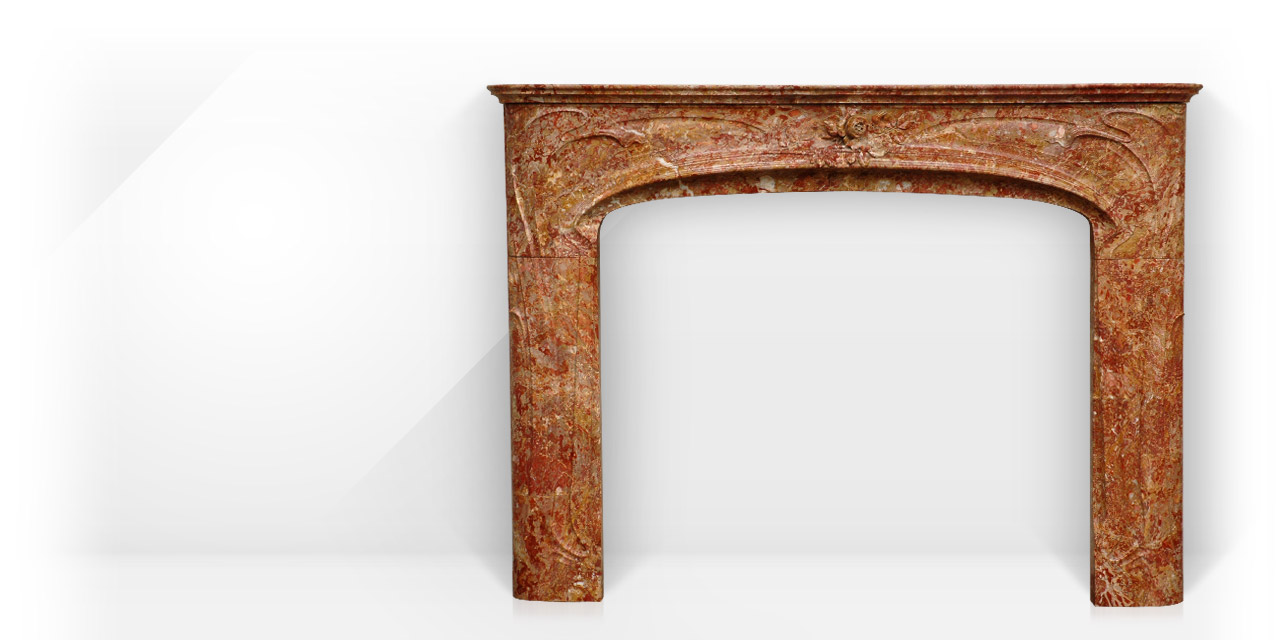 Liberty is a custom made marble fireplace of Art Nouveau style. This fireplace is made after an antique fireplace model. 