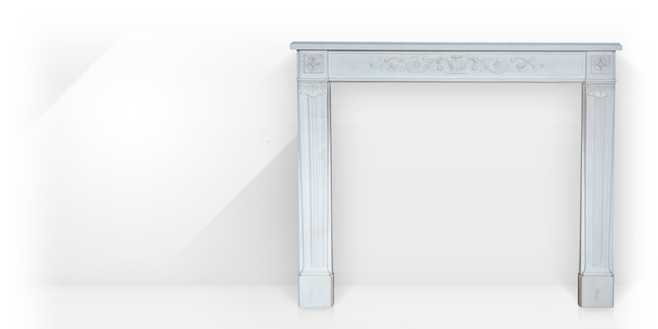 Marquis de Condorcet is a custom-made marble fireplace mantel with an entablature carved in low relief with volutes and vegetal scrolls. 