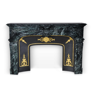 The Noailles fireplace is a highly sophisticated custom-made Regence style model made out of marble