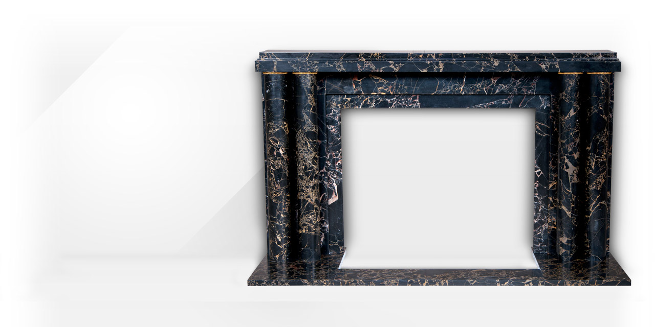 Paquebot is an Art Deco style custom-made marble fireplace decorated with a pair of double columns with gilded bronze fluted rings.