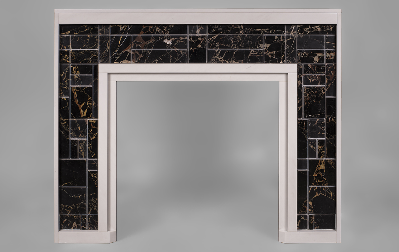 This modern fireplace is made out of Blanc P and portoro marble, with smooth, modern outlines, draws on Piet Mondrian's abstract art. Its defined structure and straight lines give the fireplace a balanced composition. It is decorated with an orthogonal grid of different shapes and sizes.The sculpture done on the many marble layers and finishes creates varied reliefs and colors, as light is reflected differently on the rectangles.