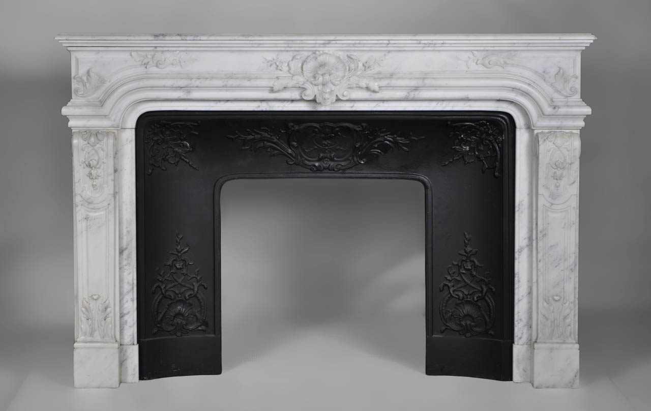 “Vendome” is a Regence style mantel made out of white Carrara marble that combines both sophistication and elegance.
Its sober lines are adorned with a remarkable sculpted decoration. The curved jambs, covered with molded panels, are garnished with lush acanthus leaves. The entablature is the result of exceptional sculpting work.This mantel's sophisticated look and the rare quality of its sculpted ornaments, make this model extremely beautiful.
This fireplace comes with its cast iron insert.